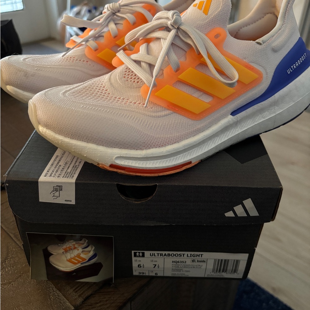 Adidas Ultraboost Light with Gold and Blue Highlights